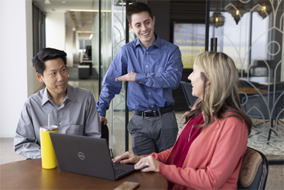 three employees having a meeting in the office